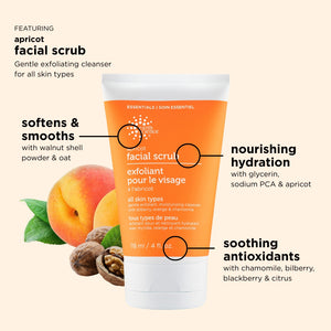 Orange facial scrub tube with apricot, walnut, and oat ingredients on a beige background