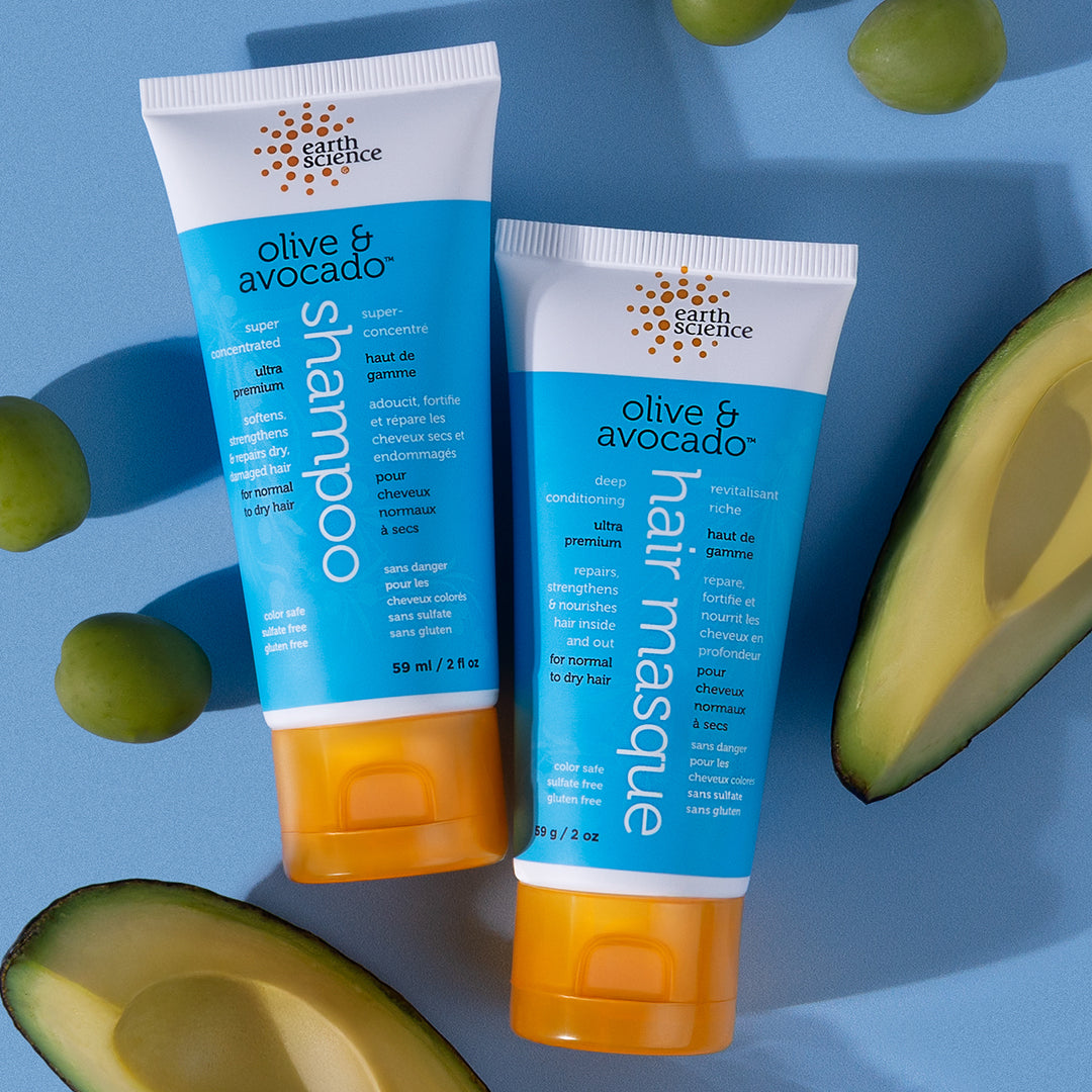 Tube of olive and avocado hair mask with blue label on a white background